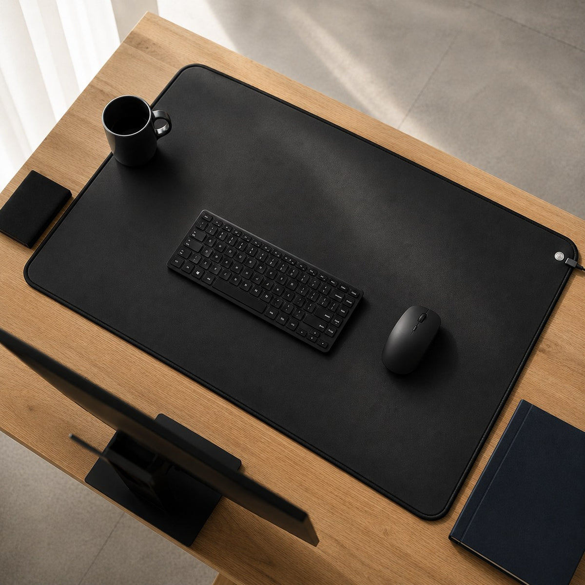 Grounding desk mat on an office desk