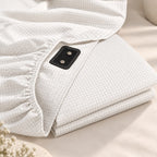 Fitted sheet folded, showing the connector tab